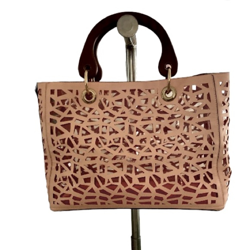 Pink Laser cut faux leather tote.